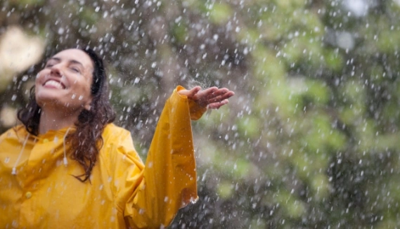 Woman in a rain shower